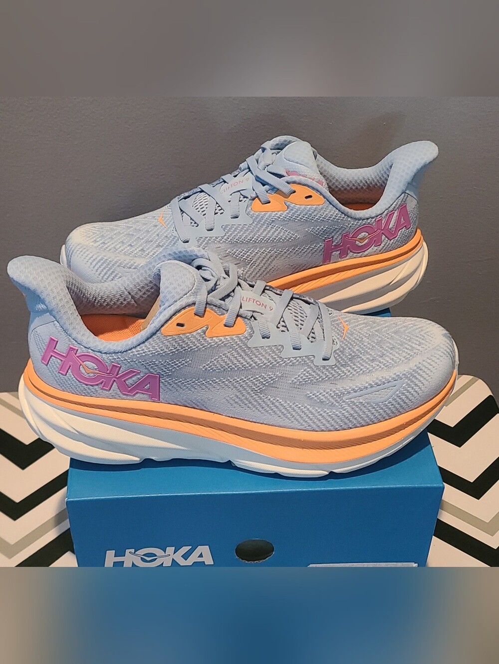 Hoka One Clifton 9 running shoes in an Airy Blue/Ice Water colorway. Size 8.5